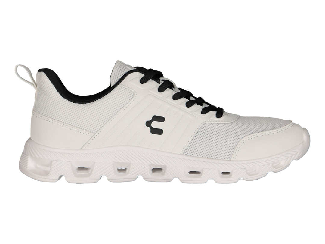 Tenis deportivos Charly color blanco con detalles en negro y suela blanca.
