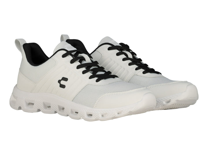 Tenis deportivos Charly color blanco con detalles en negro y suela blanca.