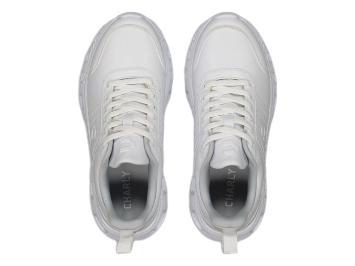 Tenis deportivos Charly color blanco con suela blanca y cordones, vista lateral.