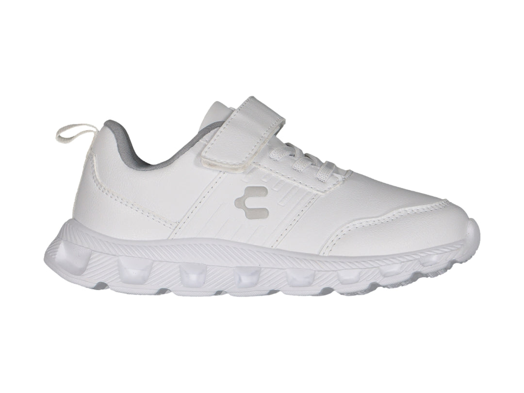 Tenis deportivos Charly para niño en color blanco con detalles en gris y cierre de velcro.