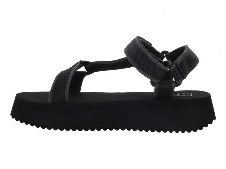 Sandalia negra de plataforma con correas y suela dentada de la marca Tommy Jeans.