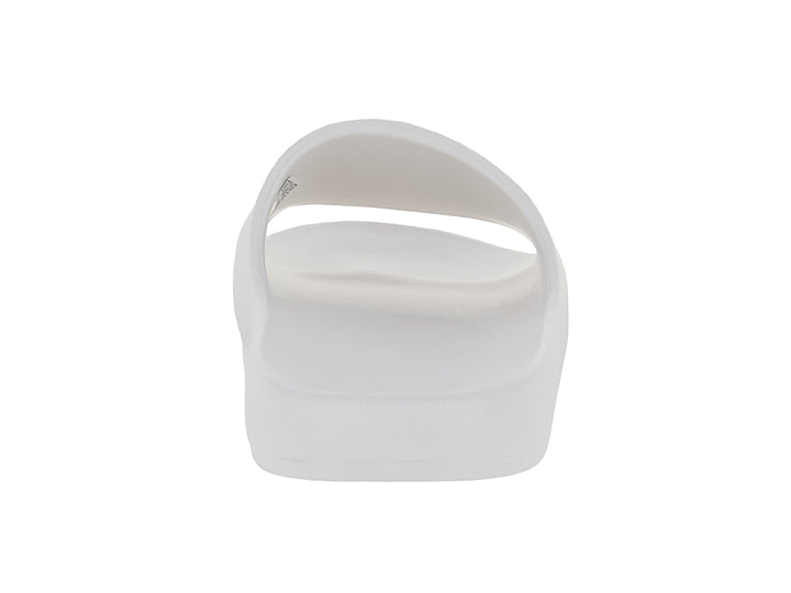 Sandalias tipo slide de color blanco ecru marca Tommy Hilfiger con banda ancha y suela moldeada.