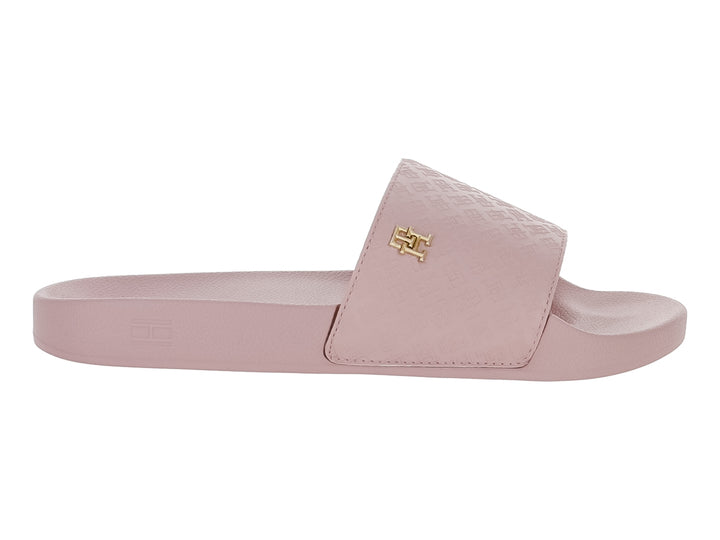 Sandalia deslizante Tommy Hilfiger en color rosa con banda superior texturizada y logotipo metálico dorado.