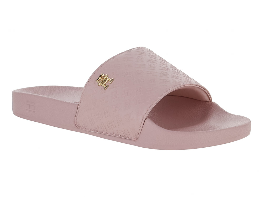 Sandalia deslizante Tommy Hilfiger en color rosa con banda superior texturizada y logotipo metálico dorado.