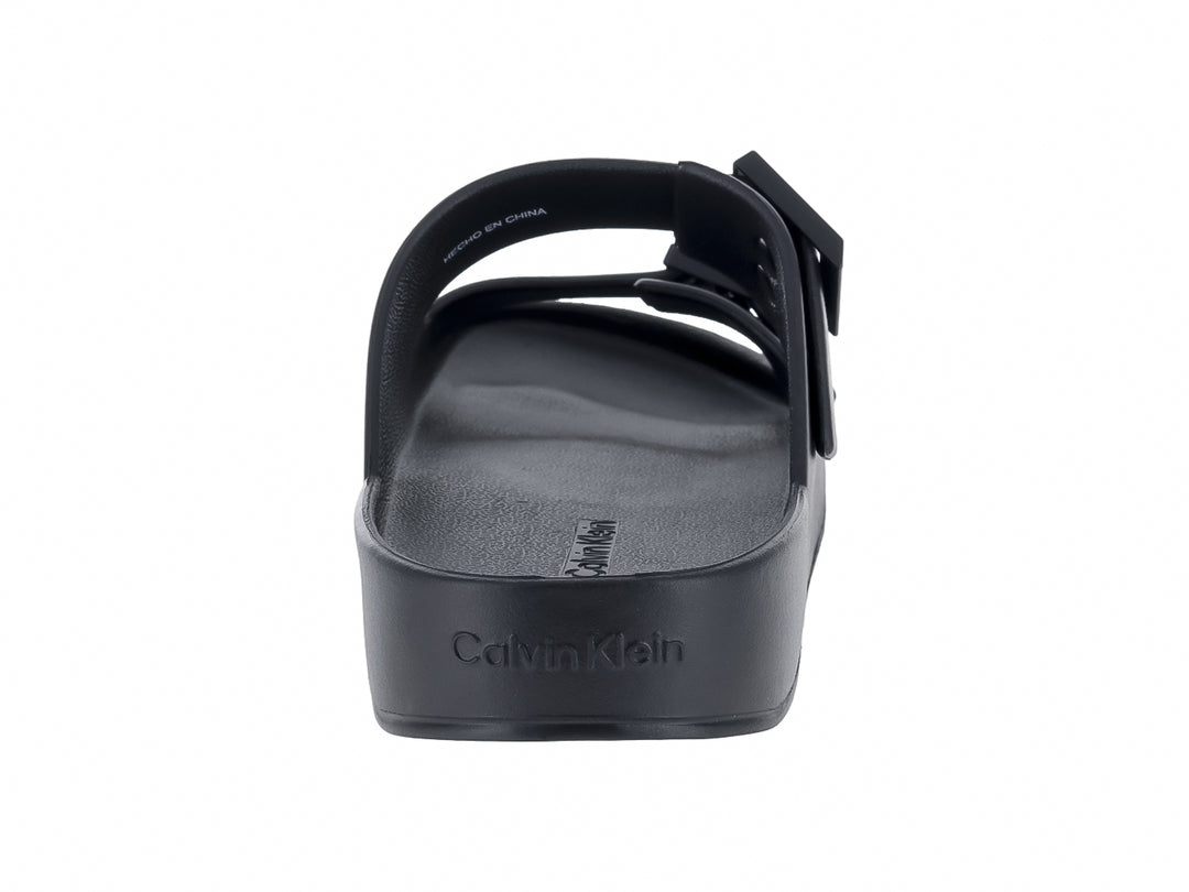 Sandalias negras de plataforma Calvin Klein con dos correas ajustables y hebillas.
