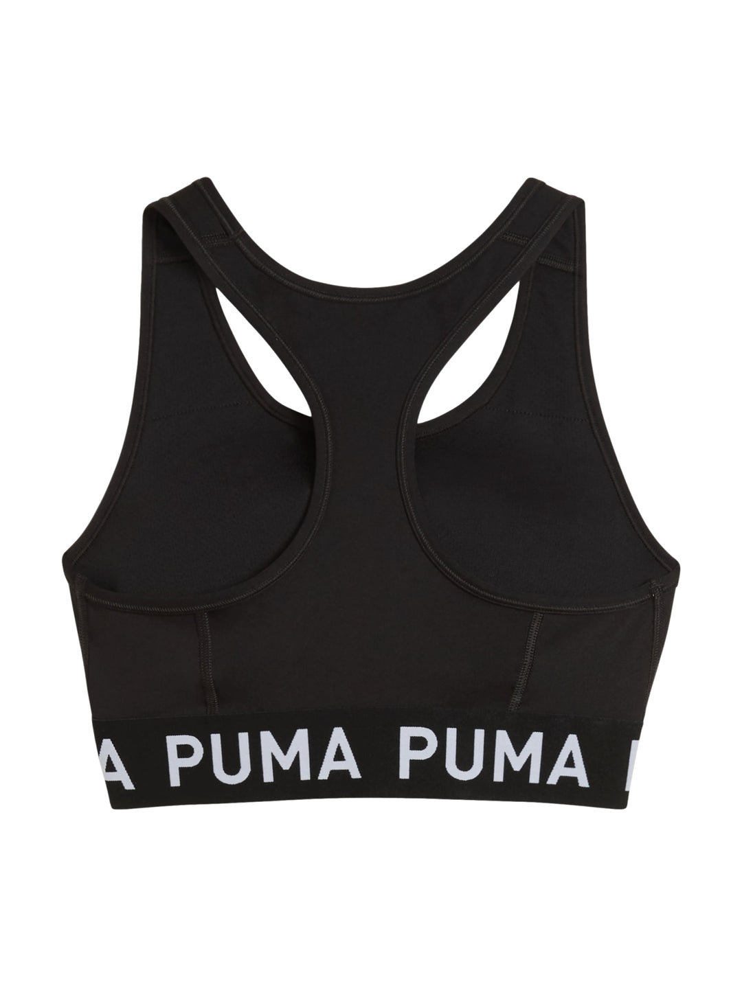 Mujer usando un bra deportivo negro de PUMA sosteniendo un balón medicinal.