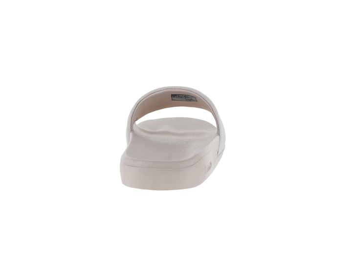Sandalia de playa Calvin Klein color beige con correa de tela y suela plana.
