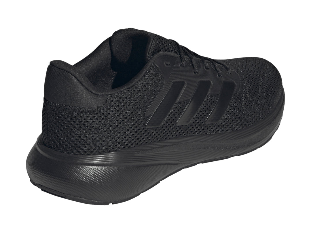 Tenis deportivos Adidas Response Runner en color negro total, vista lateral.