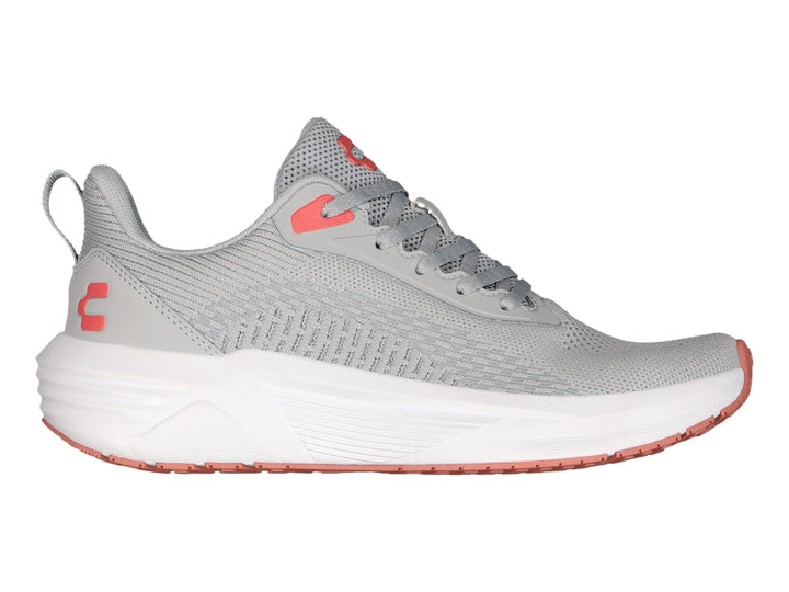 Tenis deportivos Charly color gris con suela blanca y detalles en rojo.