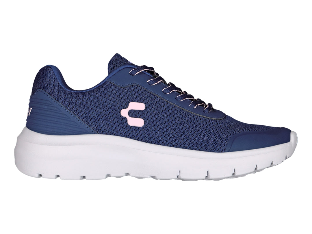 Tenis deportivos Charly en color azul marino con suela blanca y detalle rosa en el costado.