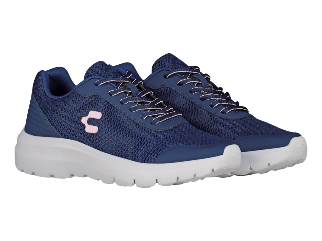 Tenis deportivos Charly en color azul marino con suela blanca y detalle rosa en el costado.