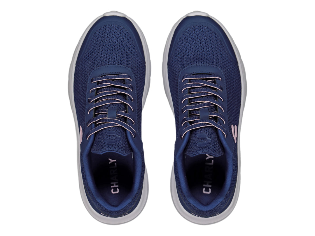 Tenis deportivos Charly en color azul marino con suela blanca y detalle rosa en el costado.