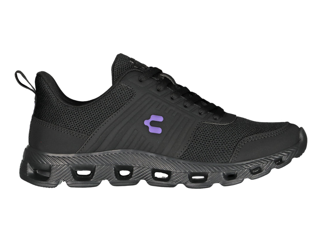 Tenis deportivos Charly color negro con suela texturizada y detalles en malla.