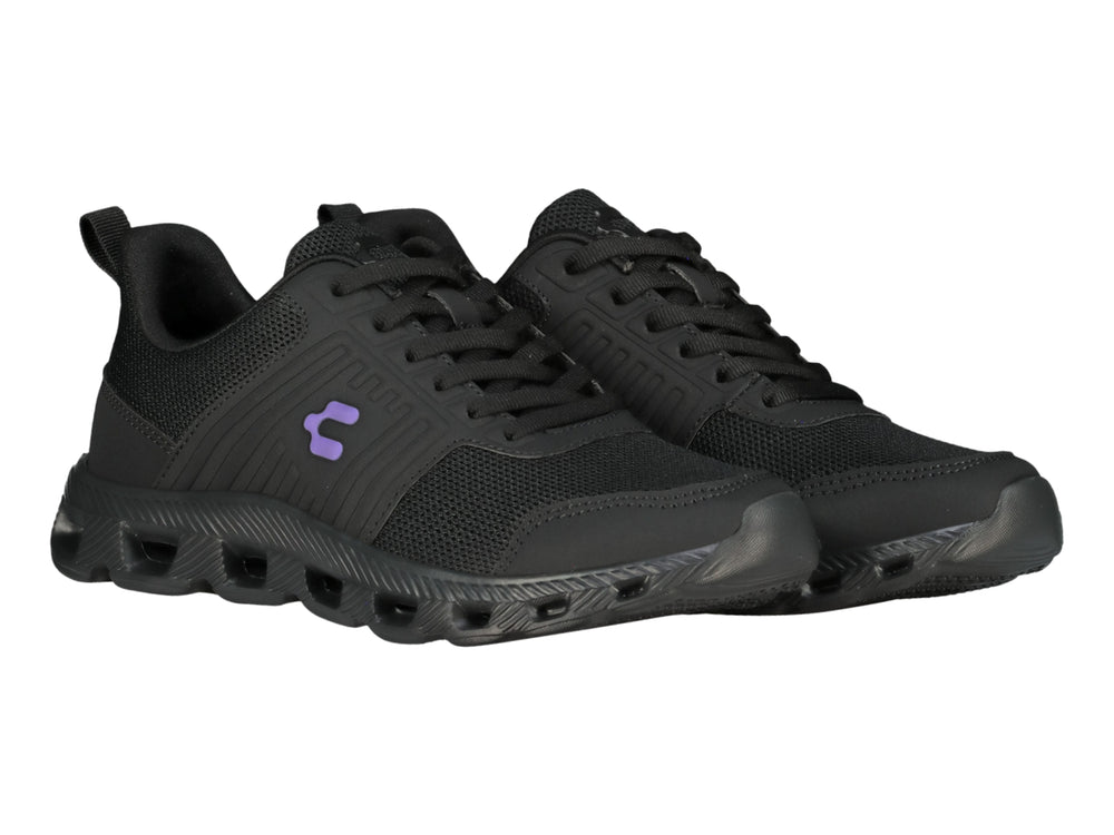 Tenis deportivos Charly color negro con suela texturizada y detalles en malla.