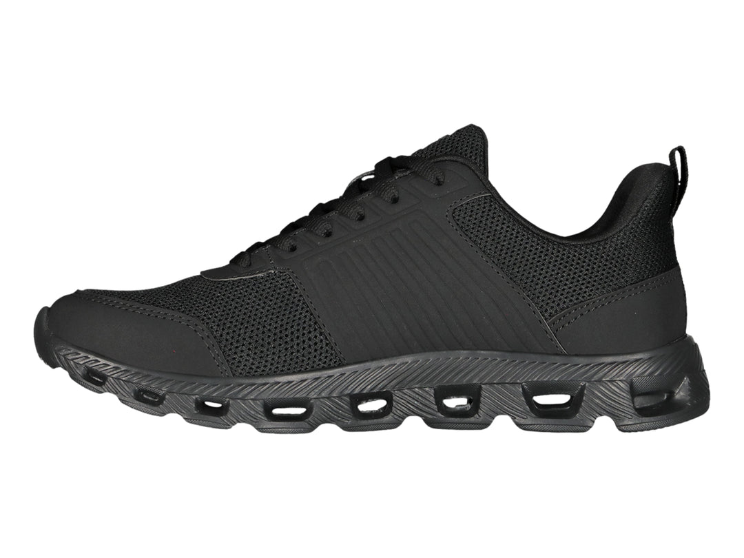 Tenis deportivos Charly color negro con suela texturizada y detalles en malla.