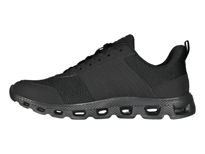 Tenis deportivos Charly color negro con suela texturizada y detalles en malla.