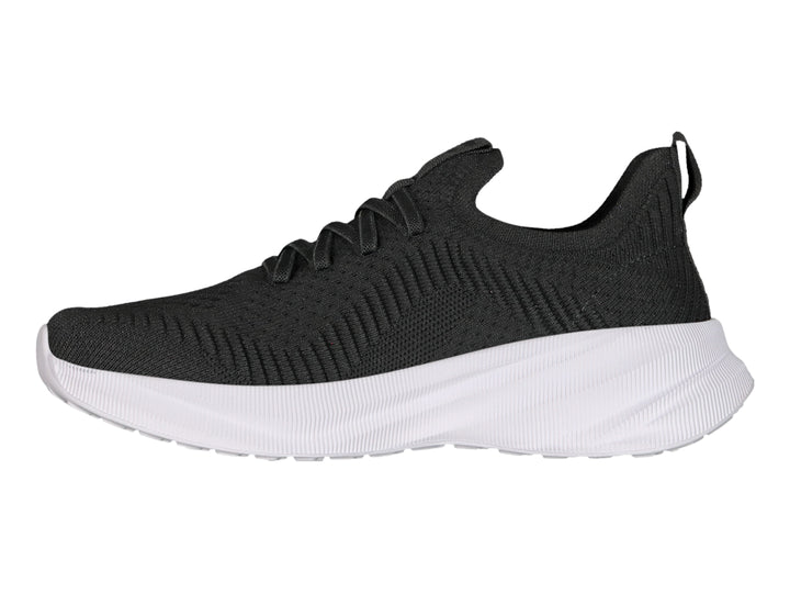 Tenis deportivos Charly color negro con suela blanca y detalle rosa en el lateral.