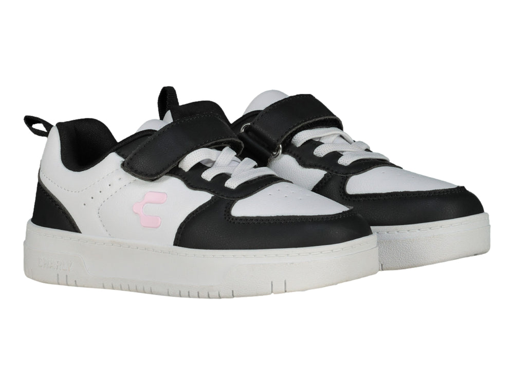 Tenis Charly blanco y negro con correa de velcro y suela blanca.