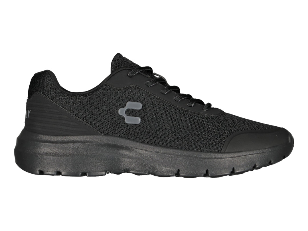 Tenis Charly Road Casual en color negro total con tejido de malla y suela cómoda.