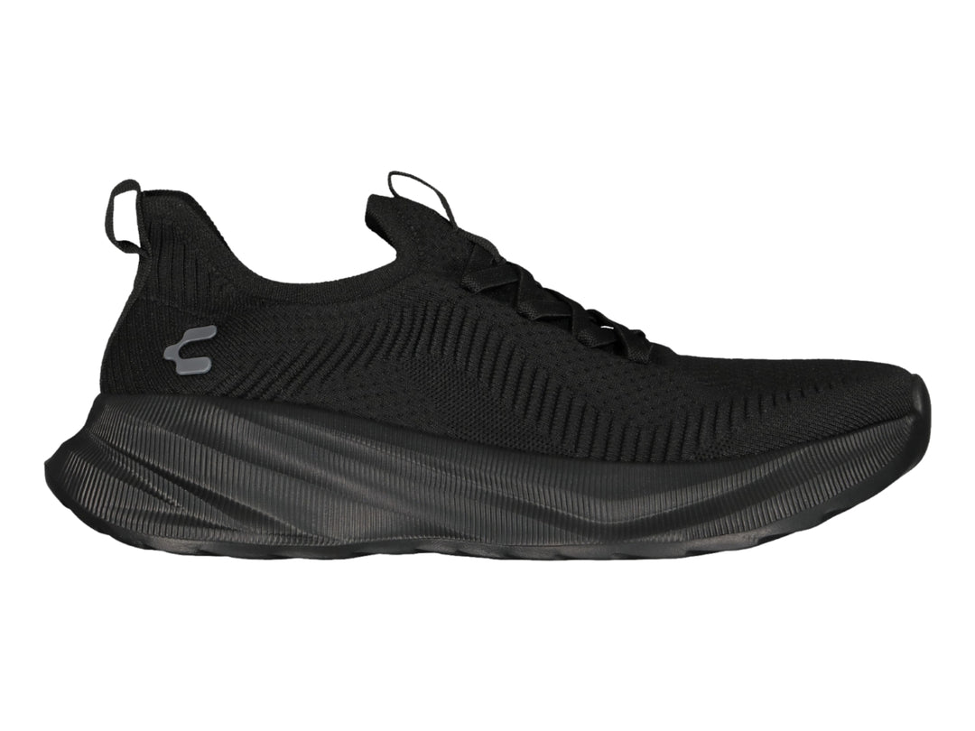 Tenis deportivos Charly color negro con tejido transpirable y suela robusta.