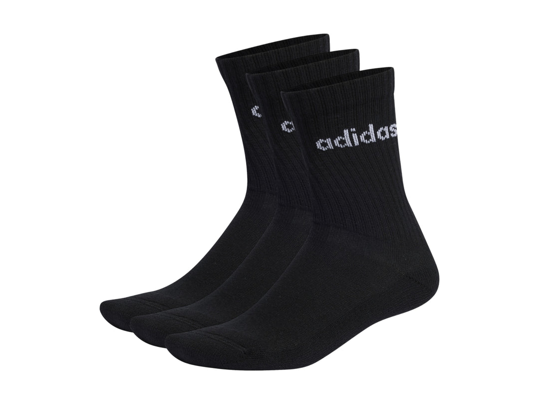 Paquete de tres pares de calcetines negros Adidas con logotipo blanco en la parte superior.