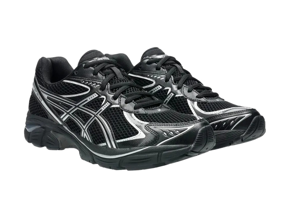 Tenis deportivos ASICS GT-2160 color negro con detalles en plata, vista lateral.