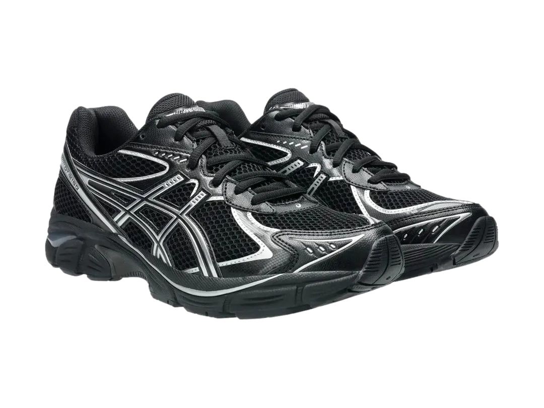 Tenis deportivos ASICS GT-2160 color negro con detalles en plata, vista lateral.