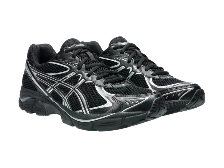 Tenis deportivos ASICS GT-2160 color negro con detalles en plata, vista lateral.