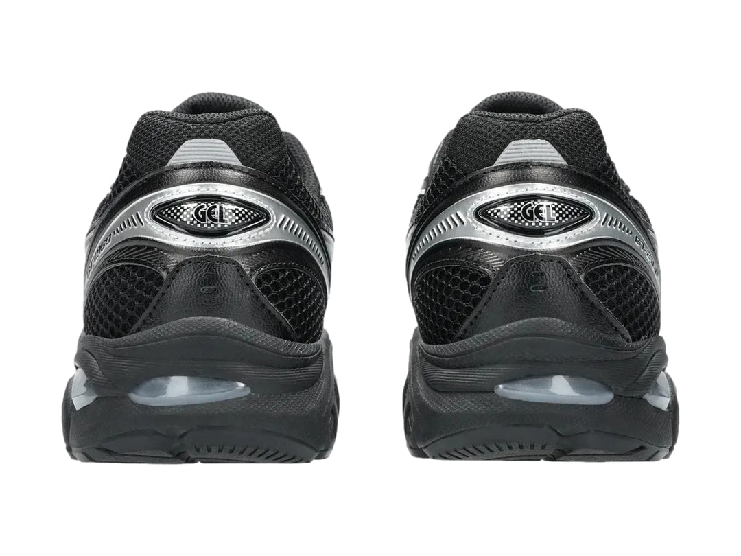 Tenis deportivos ASICS GT-2160 color negro con detalles en plata, vista lateral.