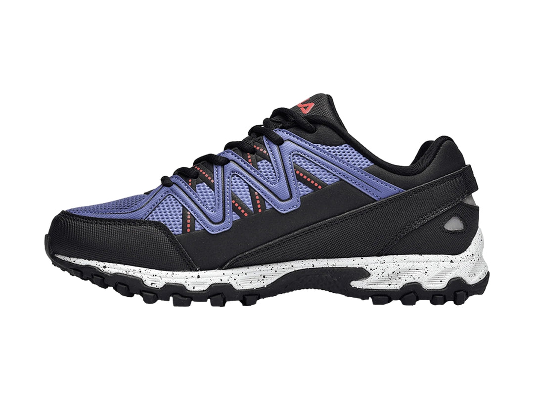 Tenis deportivos Fila Firetrail Evo en color azul y negro para niña con suela blanca y negra.
