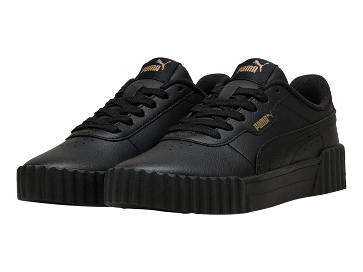 Tenis PUMA Carina 3.0 JR en color negro con suela de plataforma estriada.