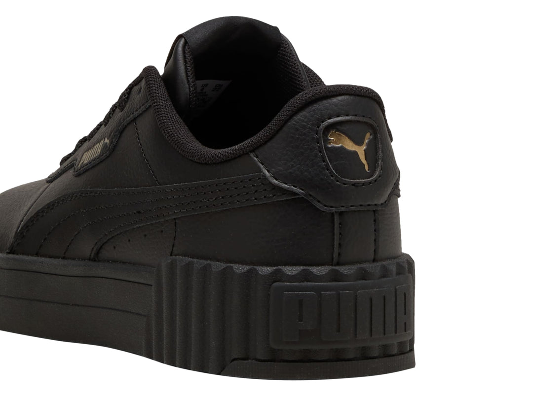 Tenis PUMA Carina 3.0 JR en color negro con suela de plataforma estriada.