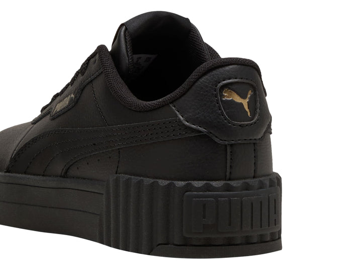 Tenis PUMA Carina 3.0 JR en color negro con suela de plataforma estriada.