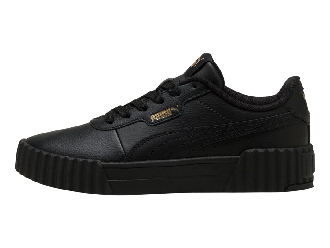 Tenis PUMA Carina 3.0 JR en color negro con suela de plataforma estriada.