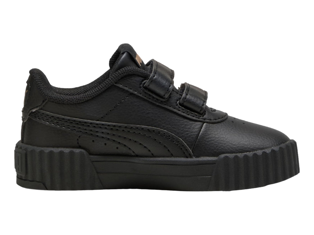 Tenis PUMA Carina 3.0 JR en color negro con cierre de velcro y suela ancha estriada.