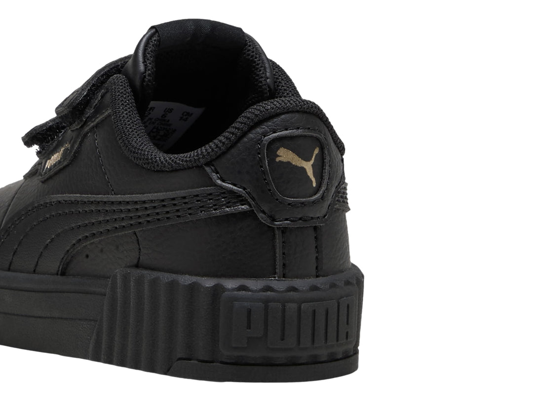 Tenis PUMA Carina 3.0 JR en color negro con cierre de velcro y suela ancha estriada.