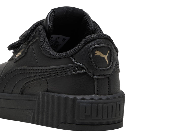 Tenis PUMA Carina 3.0 JR en color negro con cierre de velcro y suela ancha estriada.
