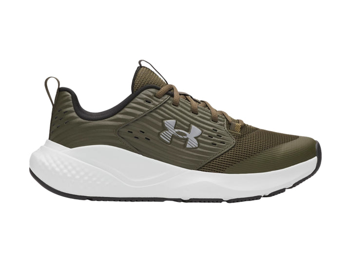 Tenis deportivos Under Armour color verde oliva con suela blanca y detalles en gris.