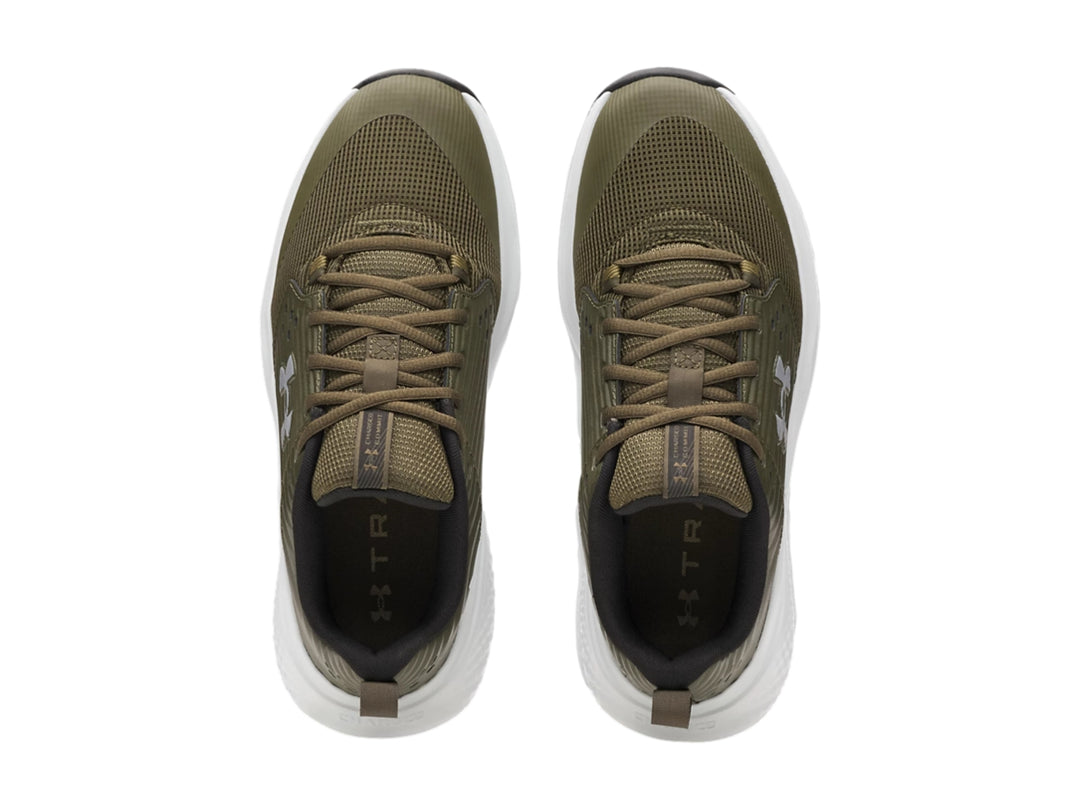 Tenis deportivos Under Armour color verde oliva con suela blanca y detalles en gris.