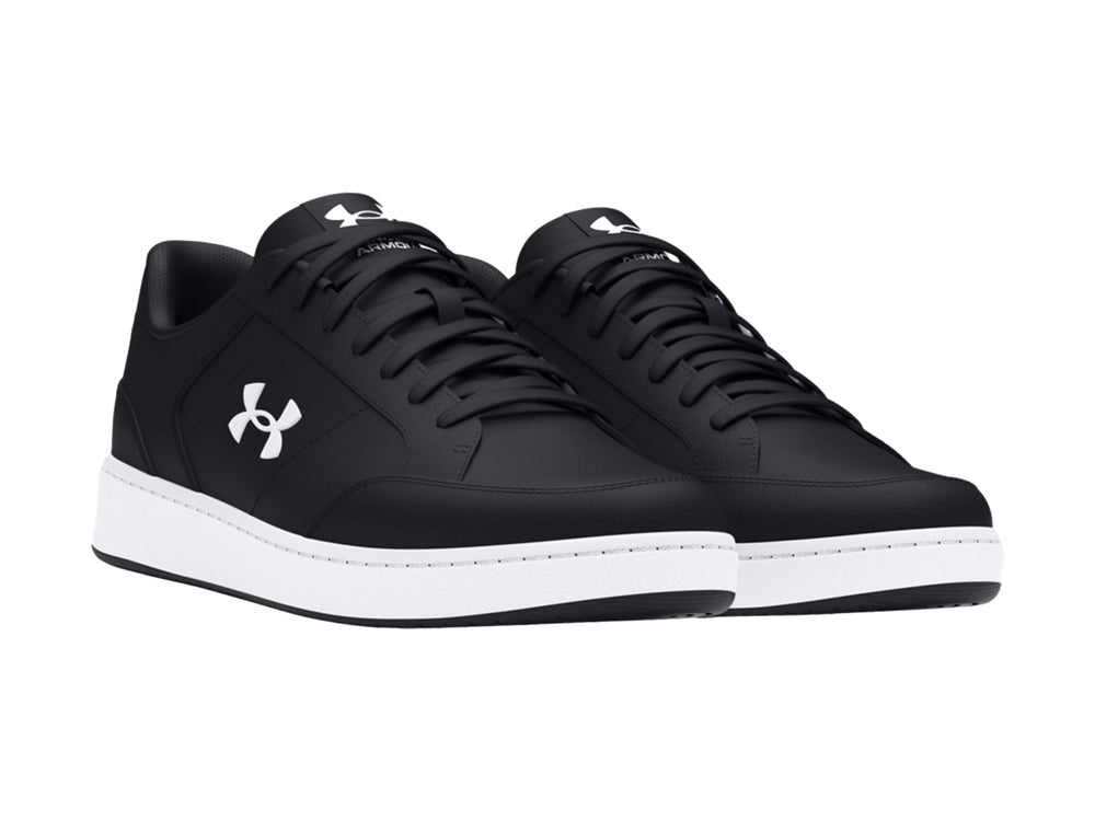 Tenis deportivos Under Armour en color negro con suela blanca y logotipo blanco lateral.