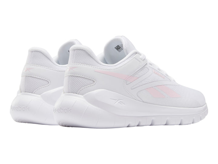 Tenis deportivos Reebok blancos con detalles en rosa claro, vista lateral.