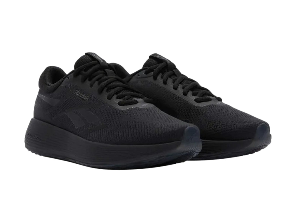 Tenis deportivos Reebok en color negro sólido con suela DMX y parte superior de malla transpirable.