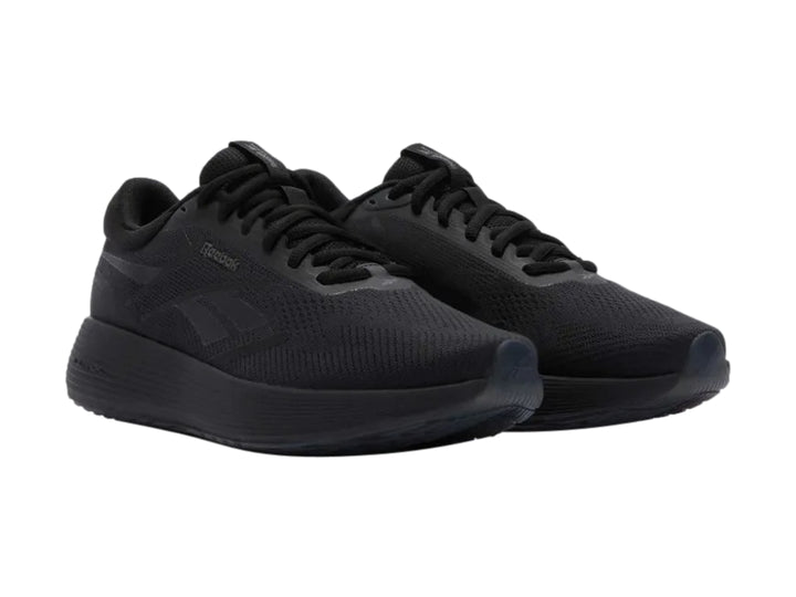 Tenis deportivos Reebok en color negro sólido con suela DMX y parte superior de malla transpirable.
