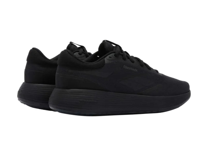 Tenis deportivos Reebok en color negro sólido con suela DMX y parte superior de malla transpirable.
