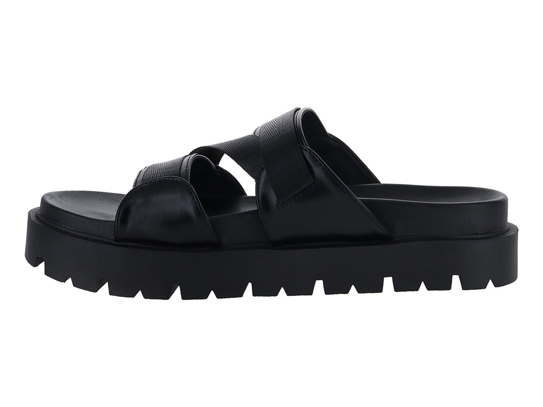 Sandalias negras de plataforma con suela dentada y correas ajustables con hebilla dorada.