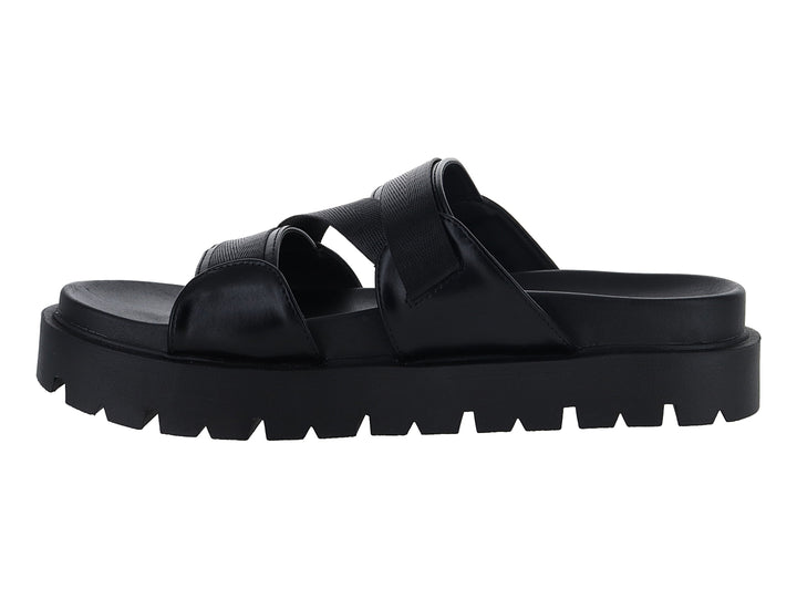 Sandalias negras de plataforma con suela dentada y correas ajustables con hebilla dorada.