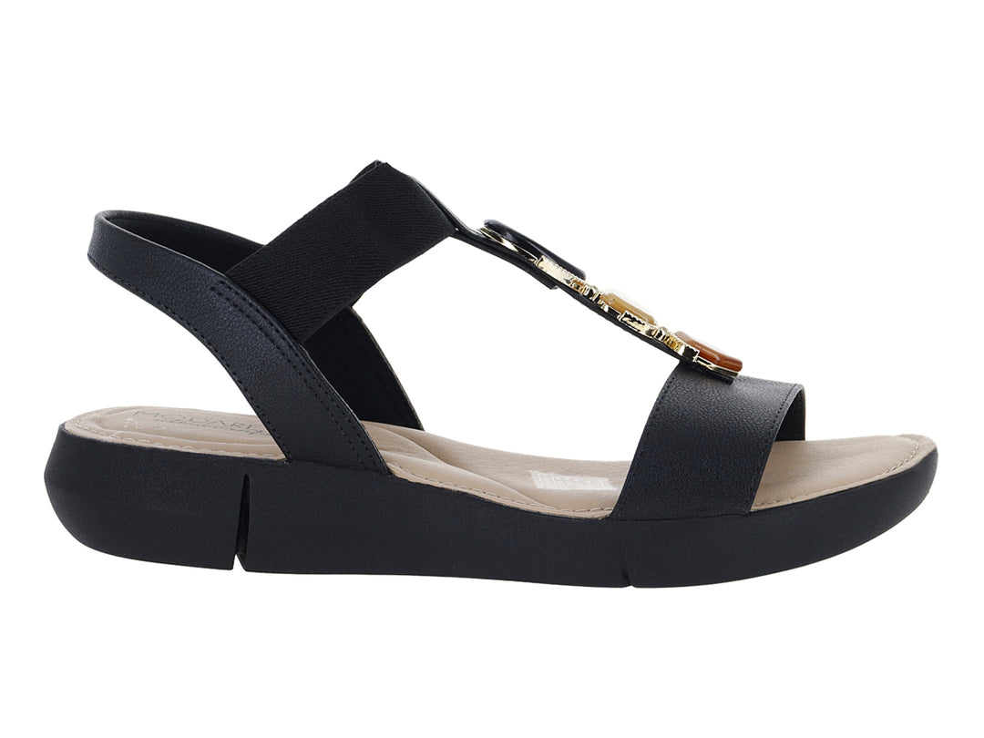 Sandalia Modare color negro con plataforma, correa elástica y detalle decorativo dorado en la parte superior.