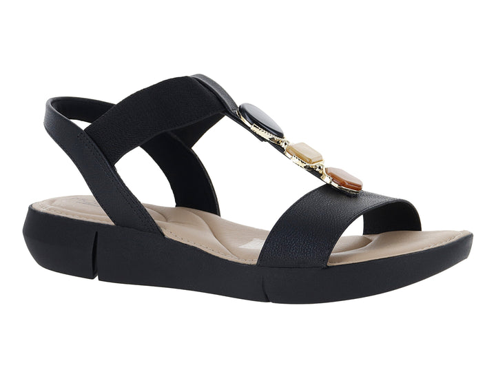 Sandalia Modare color negro con plataforma, correa elástica y detalle decorativo dorado en la parte superior.