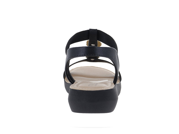 Sandalia Modare color negro con plataforma, correa elástica y detalle decorativo dorado en la parte superior.
