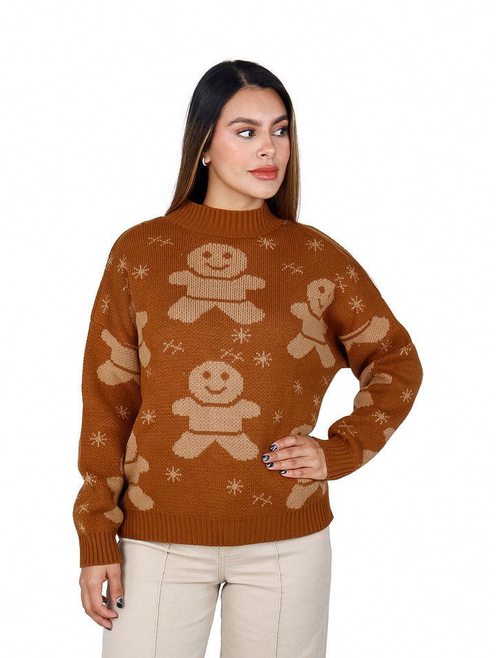 Mujer vistiendo un suéter color café con estampado de galletas de jengibre y copos de nieve en color beige.
